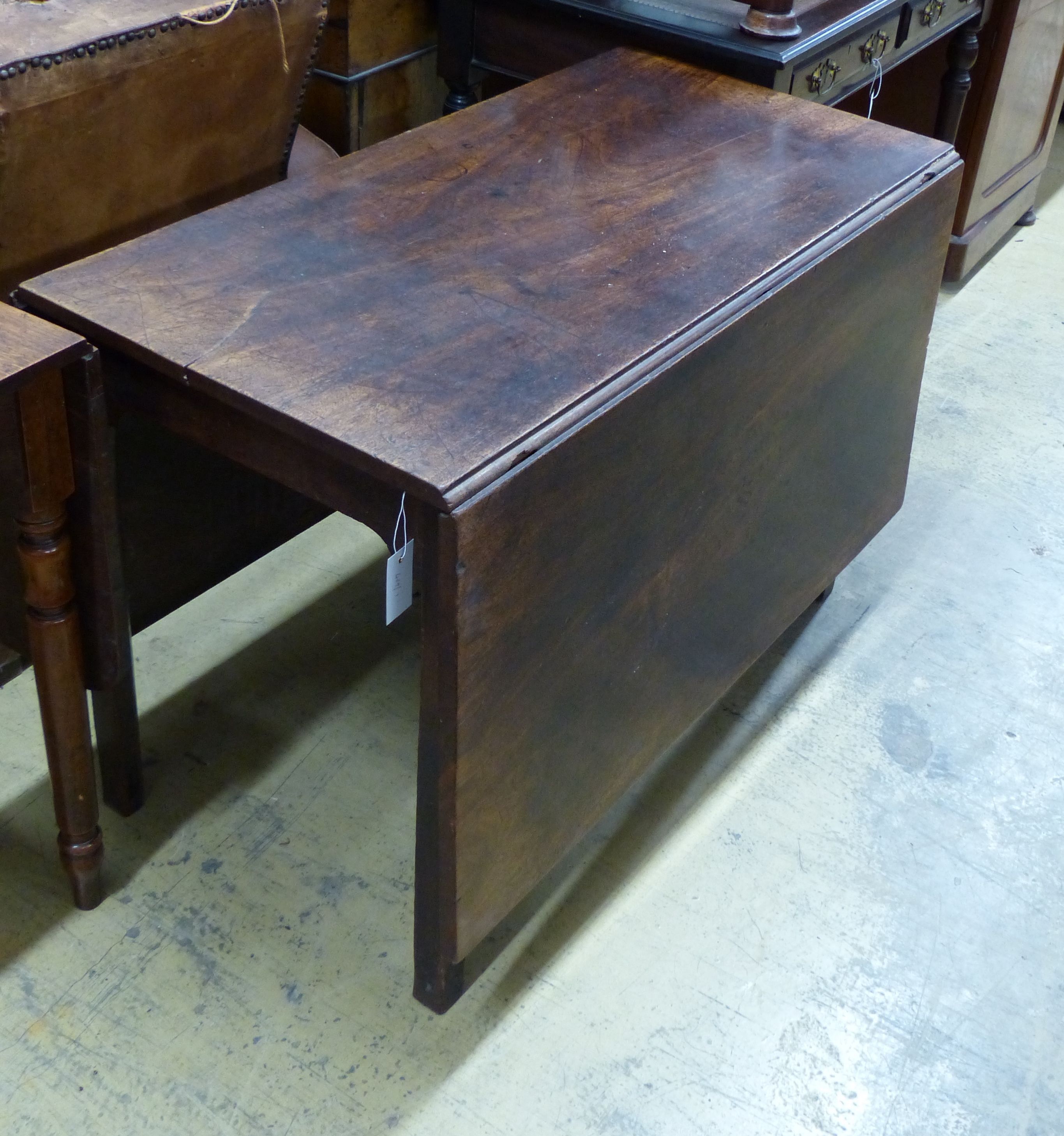 A George III mahogany drop leaf dining table, length 104cm